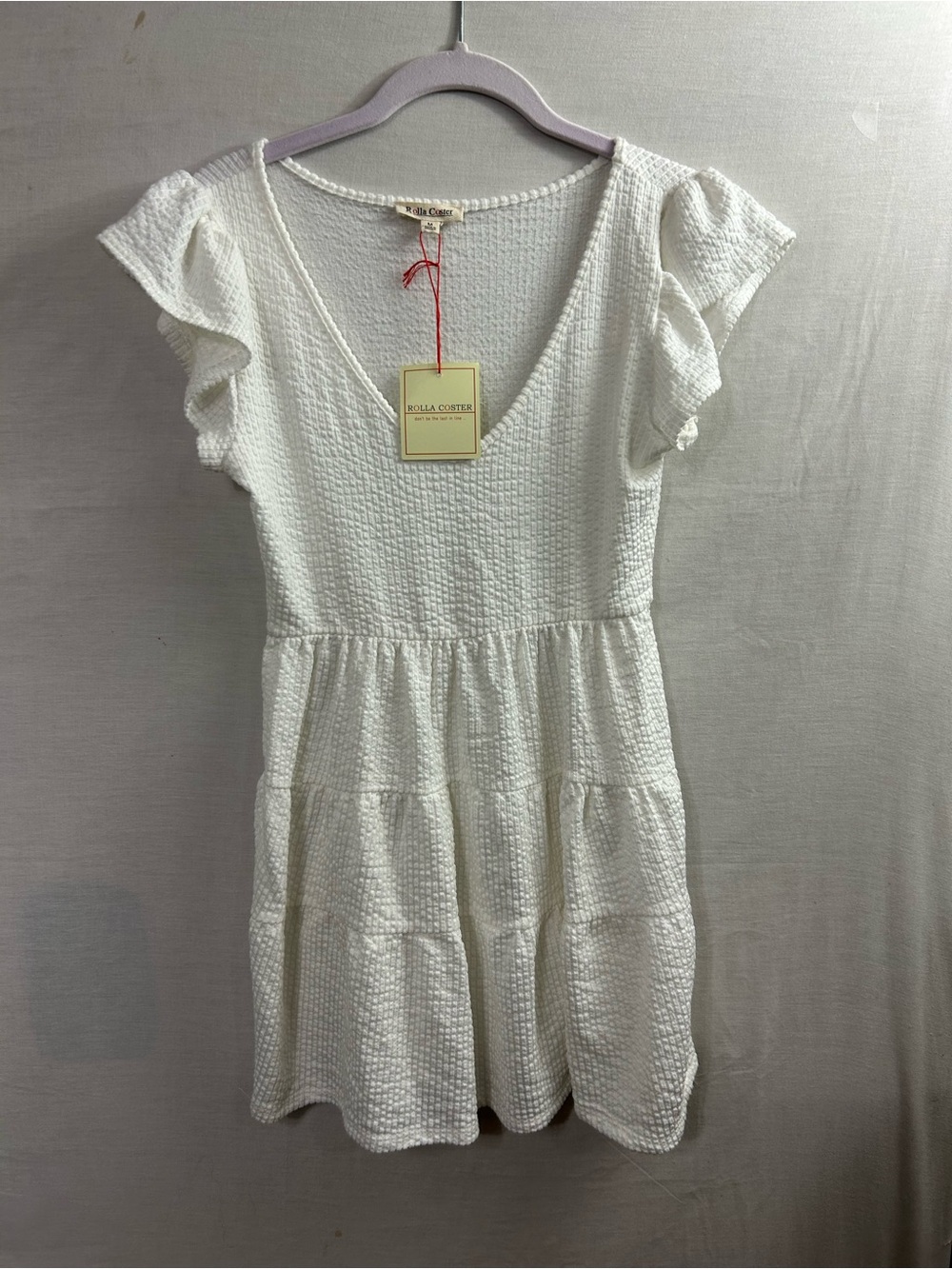 Rolla Coster mini dress features a waffle-textured white fabric